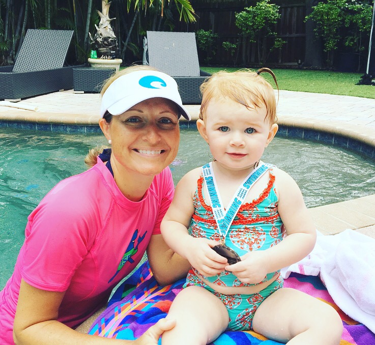 Audrey(1 year old) swim/float/swim the length of pool. Getting her swim medal